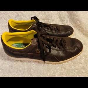 Puma: Vintage Pele Special Edition Sneakers.